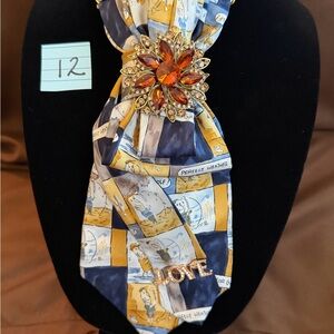 Navy and Gold Patterned Silk Scarf Tie with Decorative Brooch